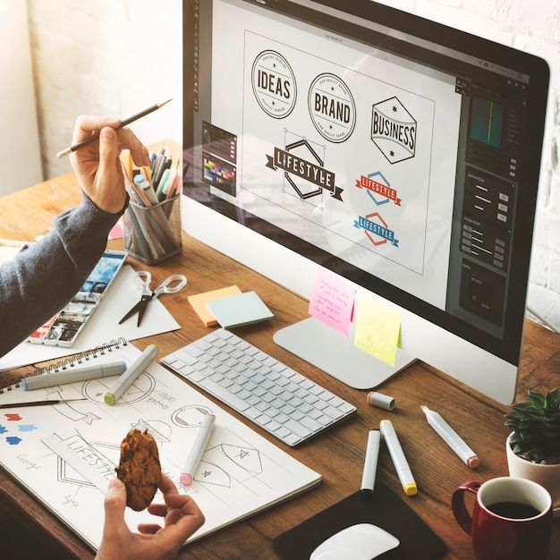 Designer working on a creative branding project with digital sketchpad and color palette